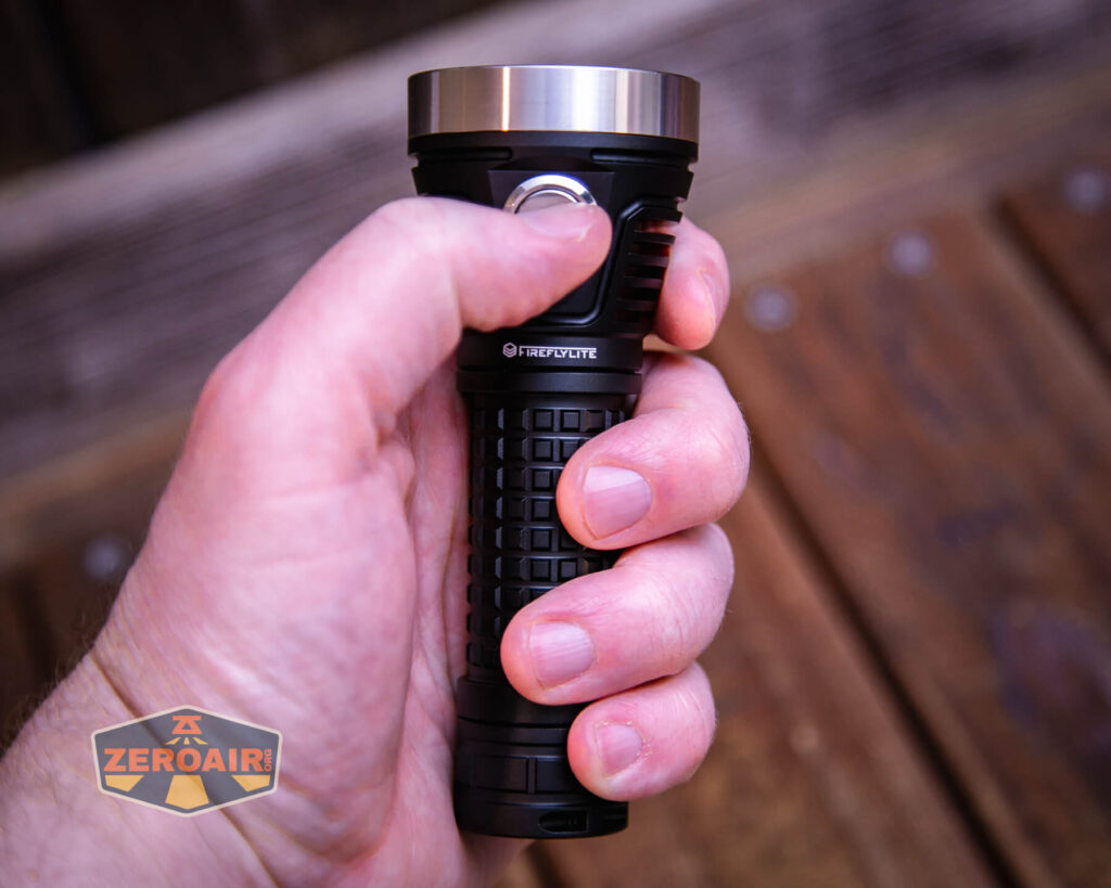 FireflyLite E12C flashlight in hand