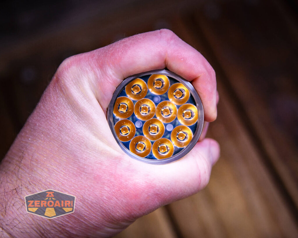 FireflyLite E12C flashlight in hand