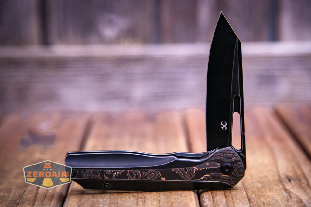 Kansept Shard blackwashed titanium knife half open with Kansept logo