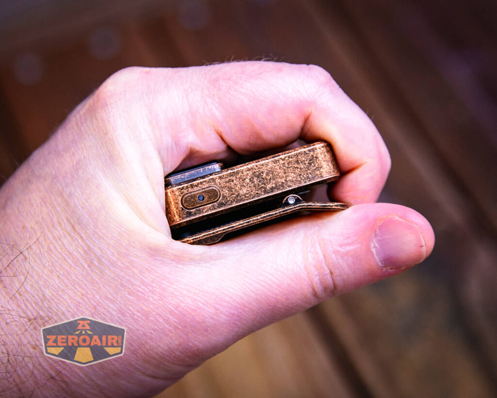 Olight Oclip Cu Clip flashlight in hand 