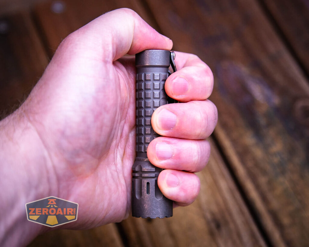 EDC Titanium 14500 flashlight in hand