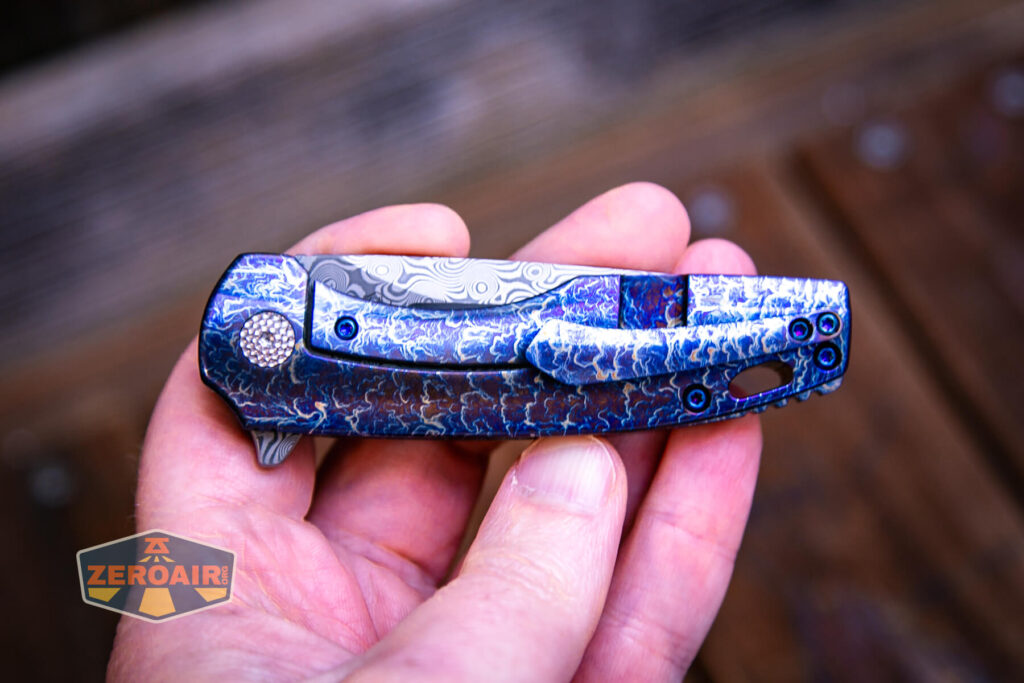 Kansept Cassowary titanium flipper knife in hand