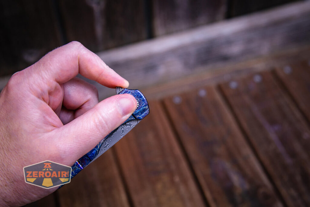 Kansept Cassowary titanium flipper knife flipping open