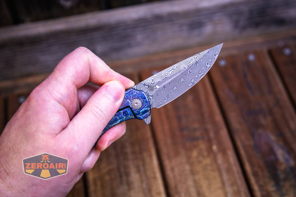 Kansept Cassowary titanium flipper knife flipped open