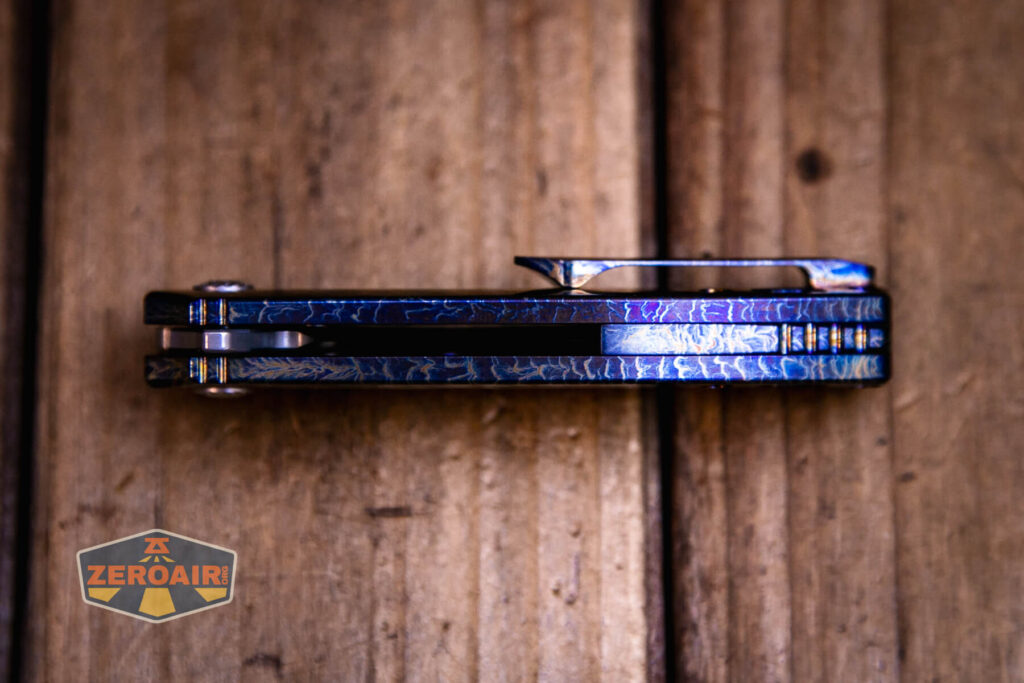 Kansept Cassowary titanium flipper knife top view showing backspacer