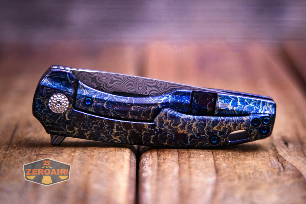 Kansept Cassowary titanium flipper knife clip side with pivot detail