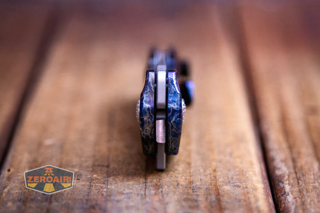 Kansept Cassowary titanium flipper knife pivot end view