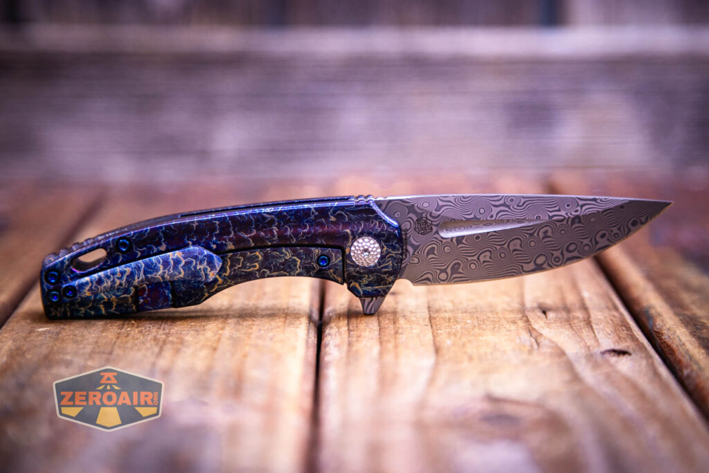 Kansept Cassowary titanium flipper knife fully open, clip side