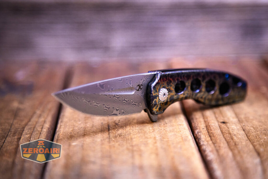 Kansept Cassowary titanium flipper knife three quarter view