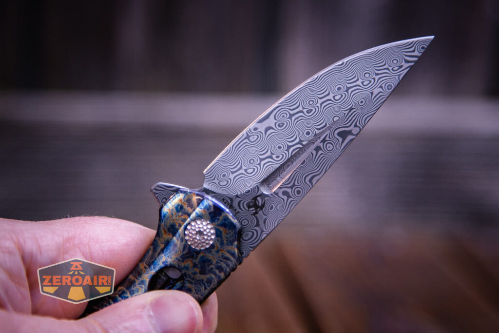 Kansept Cassowary titanium flipper knife blade detail