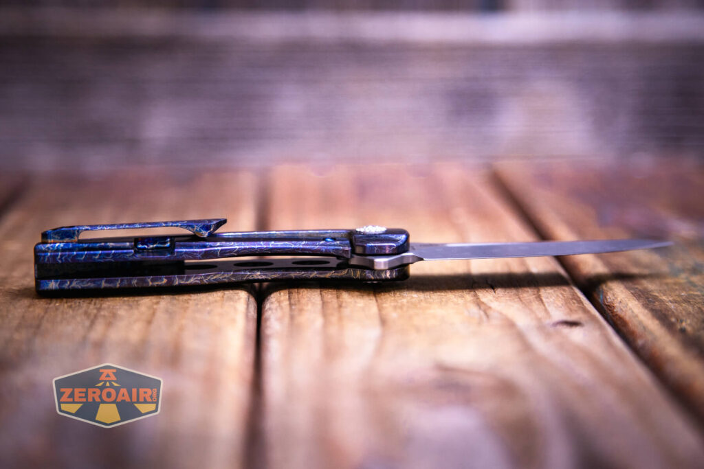 Kansept Cassowary titanium flipper knife blade open showing inside