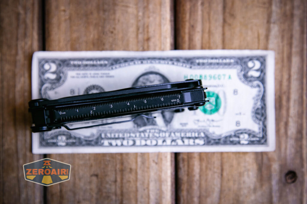 Nextorch MT10 multi-tool on a two dollar bill