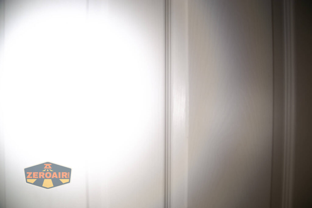 Sofirn SC13 Nichia 519a flashlight beamshots on door (at 1') compared to nichia 219b 4500K