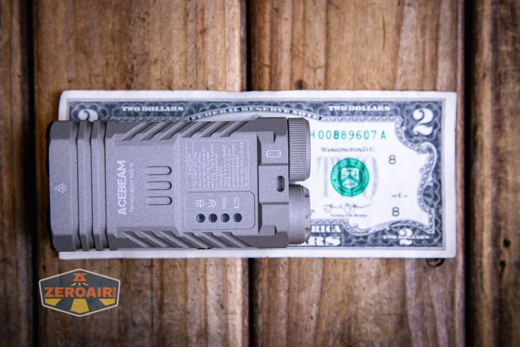 Acebeam Terminator M2-X flashlight on a two dollar bill