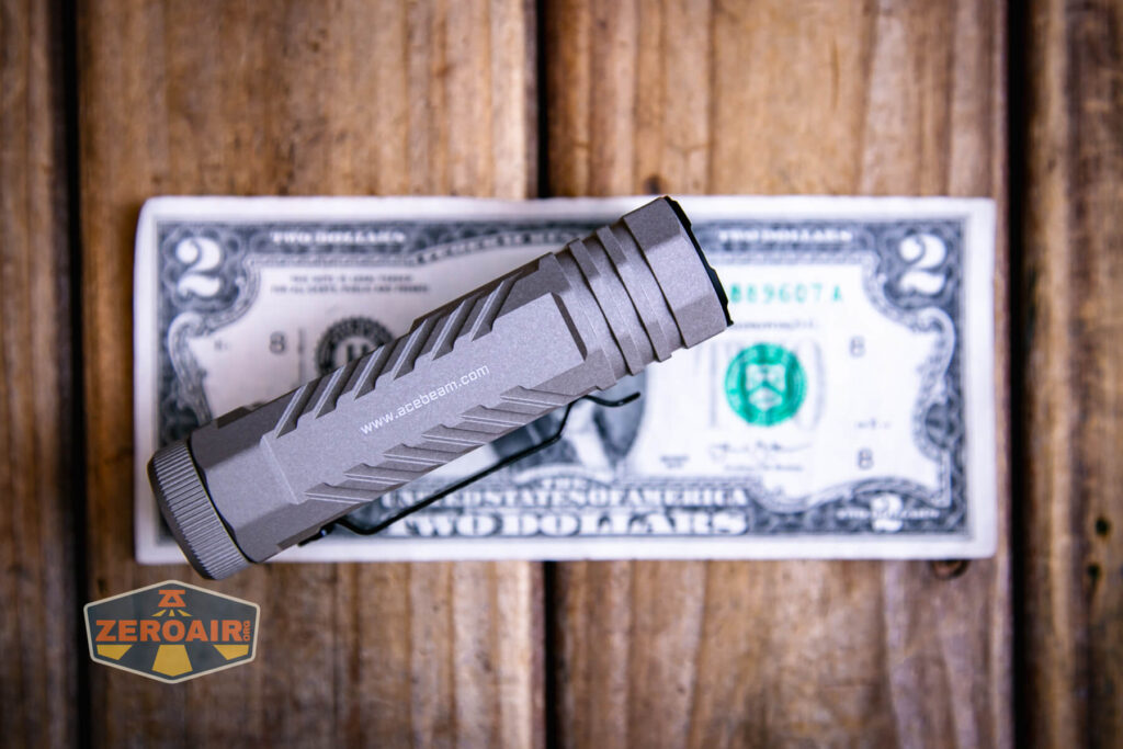 Acebeam Terminator M2-X flashlight on a two dollar bill