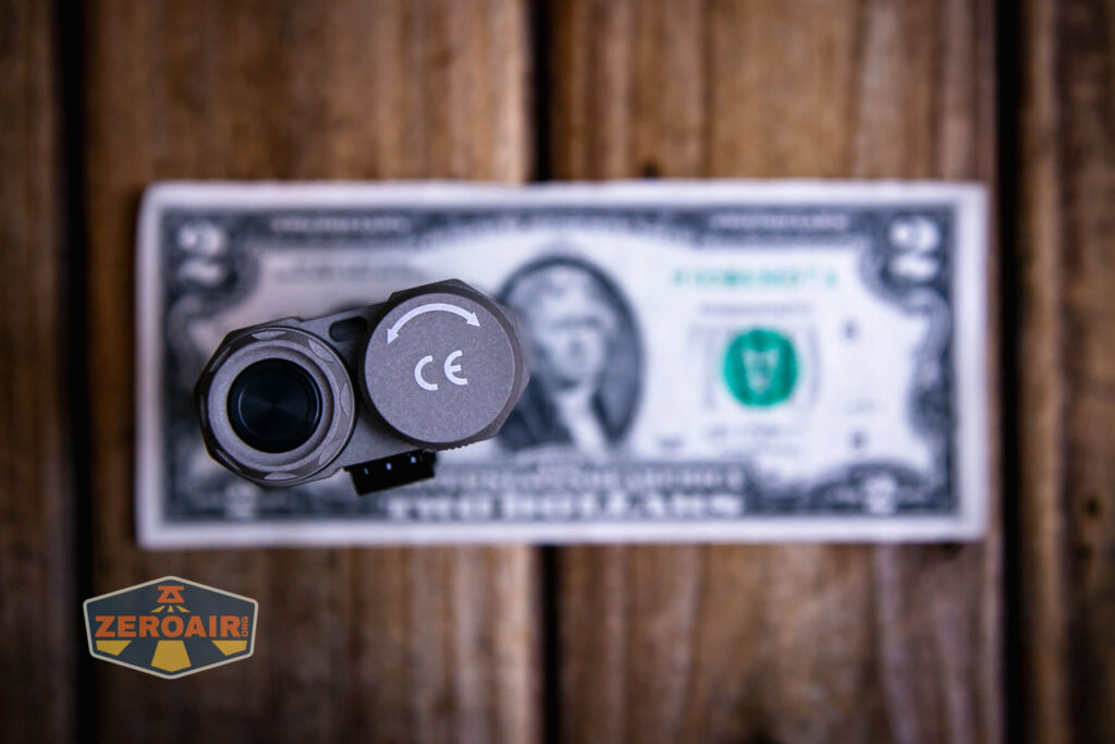 Acebeam Terminator M2-X flashlight on a two dollar bill