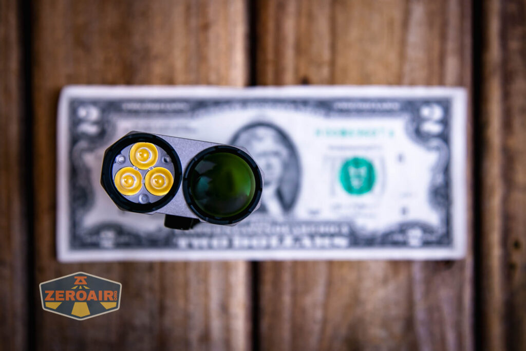 Acebeam Terminator M2-X flashlight on a two dollar bill