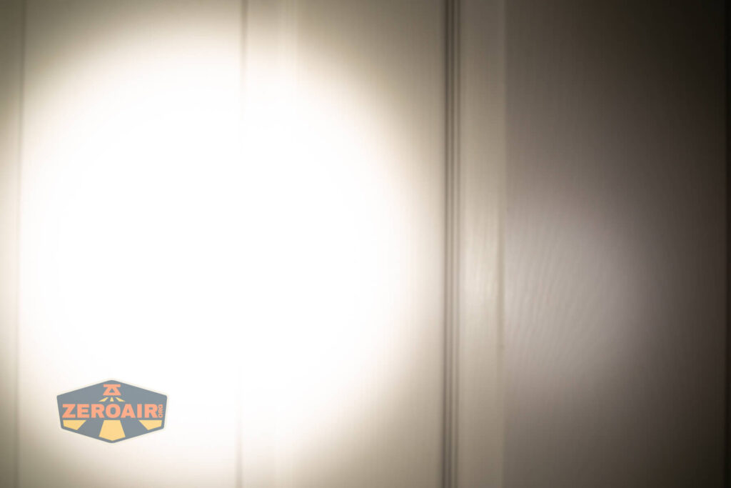 Acebeam Terminator M2-X flashlight beamshots on door (at 1') compared to nichia 219b 4500K