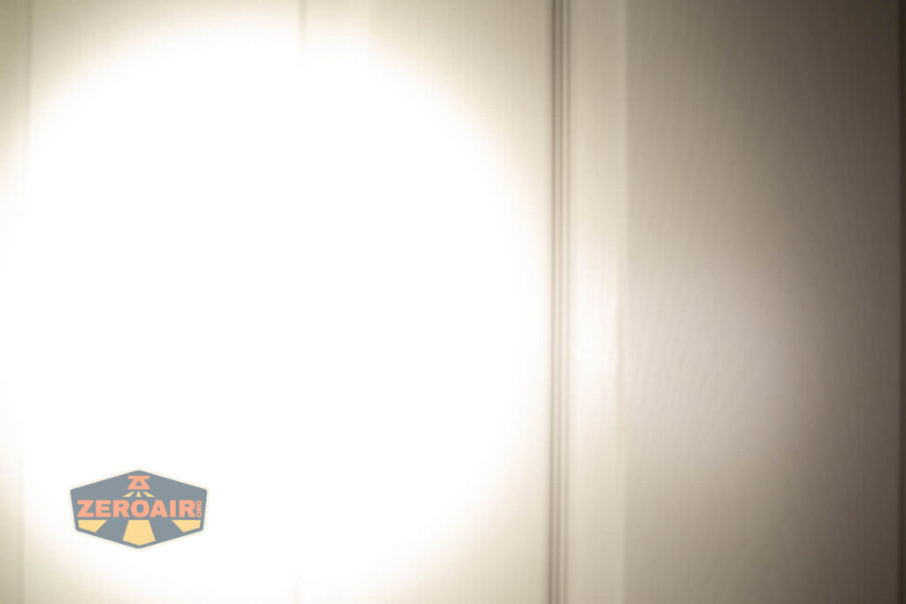 Acebeam Terminator M2-X flashlight beamshots on door (at 1') compared to nichia 219b 4500K