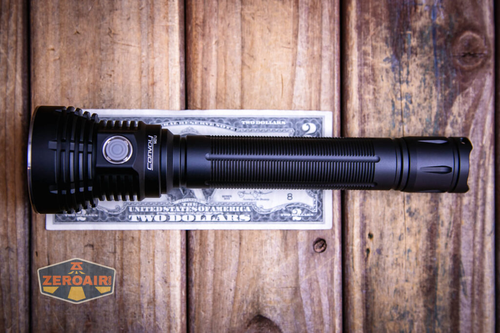 Convoy M21J 21700 flashlight on a two dollar bill