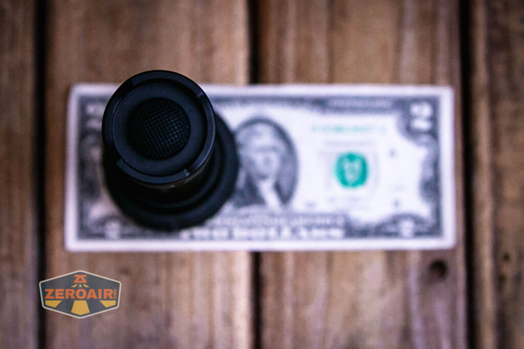 Convoy M21J 21700 flashlight on a two dollar bill