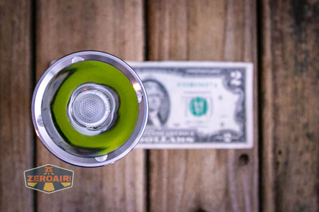 Convoy M21J 21700 flashlight on a two dollar bill