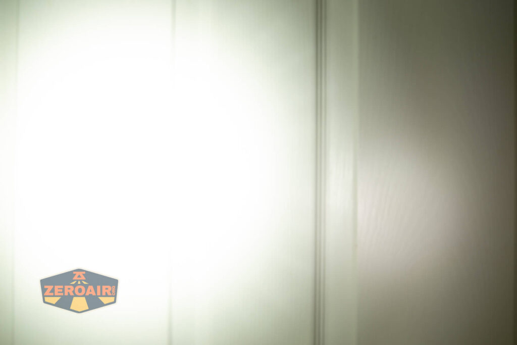 Convoy M21J 21700 flashlight beamshots on door (at 1') compared to nichia 219b 4500K