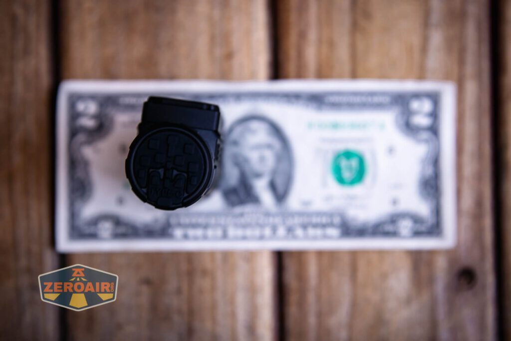 Imalent HT70 headlamp on a two dollar bill