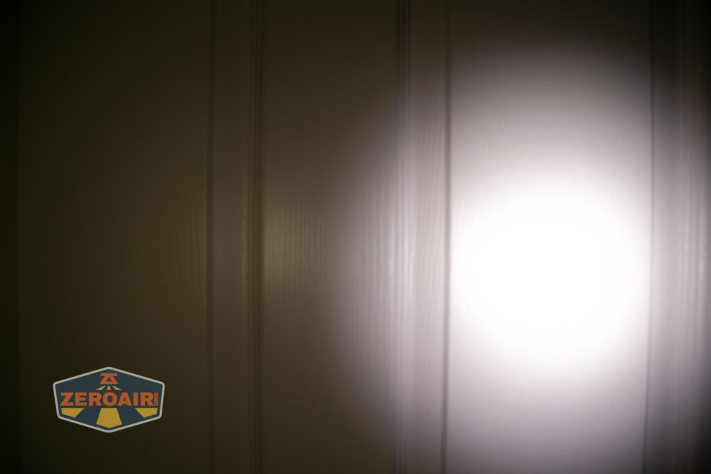 Imalent HT70 headlamp beamshots on door (at 1') compared to nichia 219b 4500K