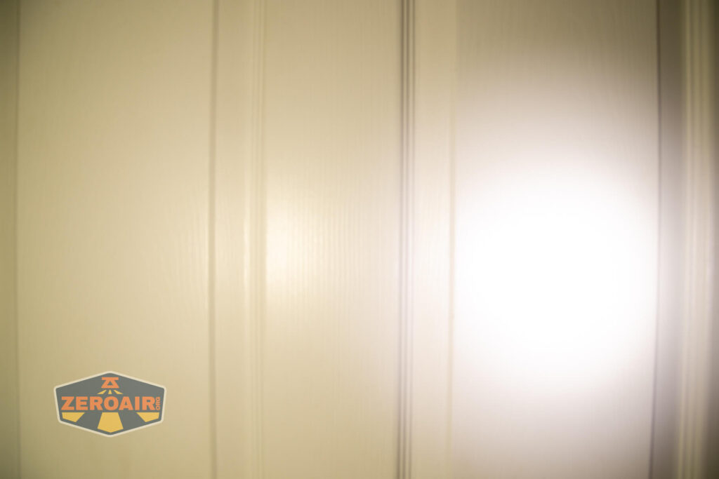 Imalent HT70 headlamp beamshots on door (at 1') compared to nichia 219b 4500K