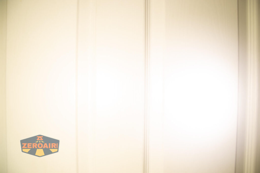 Imalent HT70 headlamp beamshots on door (at 1') compared to nichia 219b 4500K