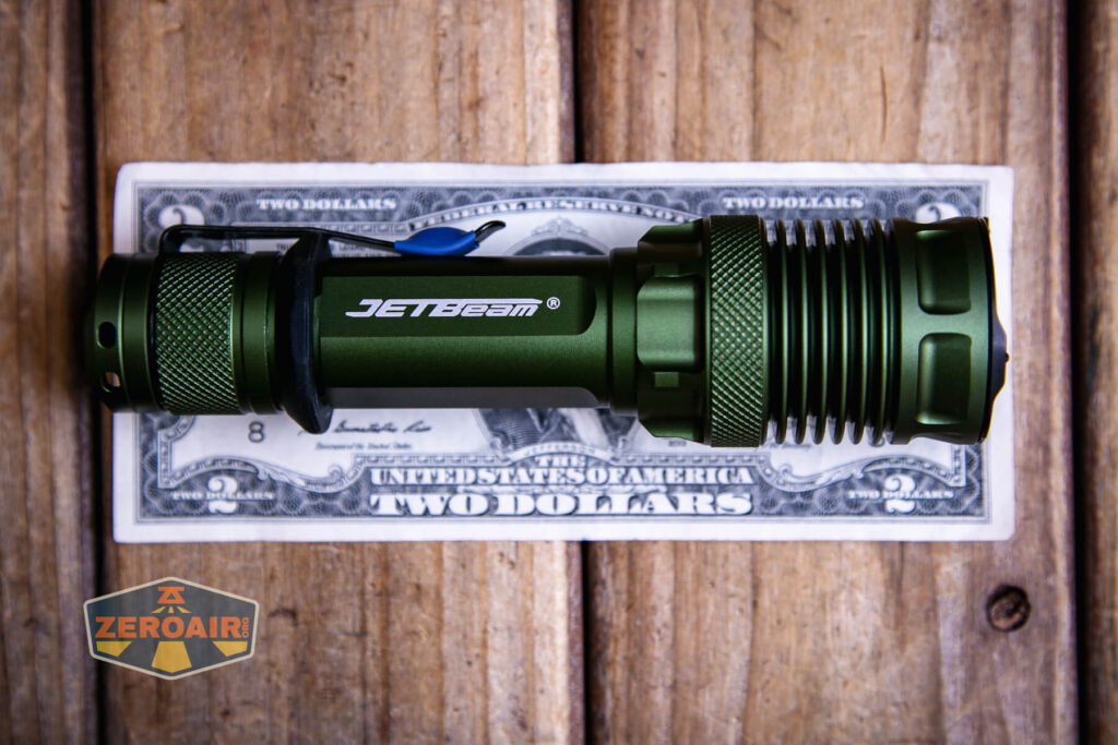 JETBeam M37 Pro flashlight on a two dollar bill