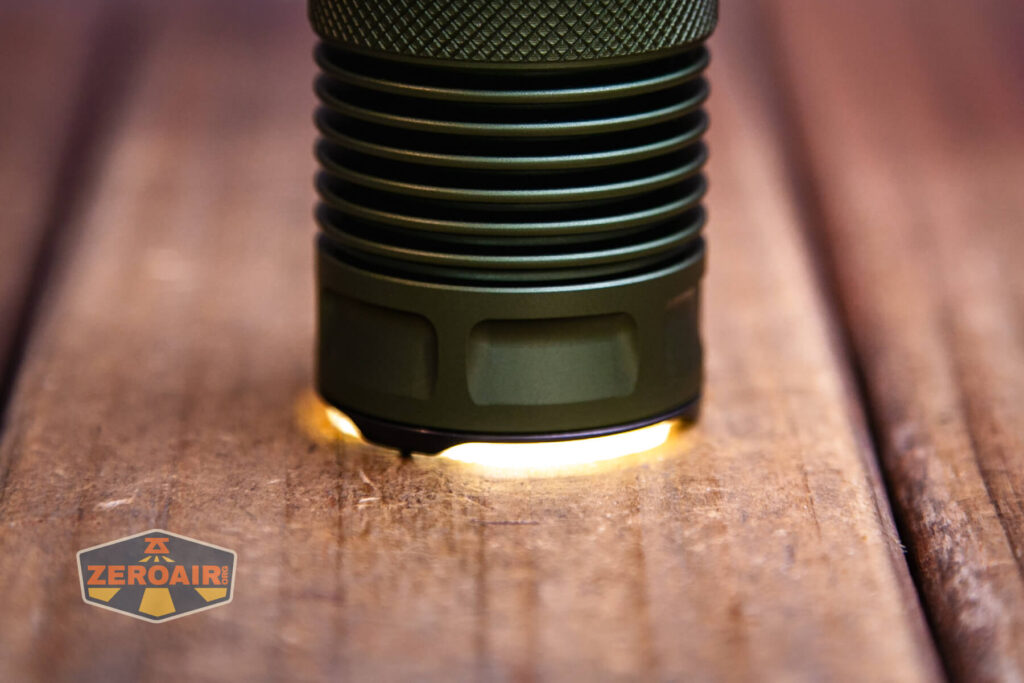 JETBeam M37 Pro flashlight emitter on and headstanding