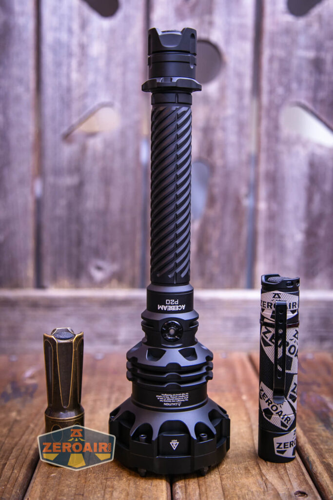 Acebeam P20 flashlight with two standard sized flashlights 