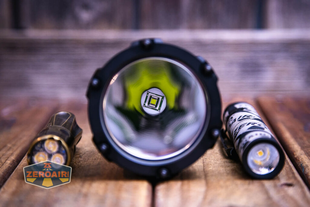 Acebeam P20 flashlight with two standard sized flashlights 