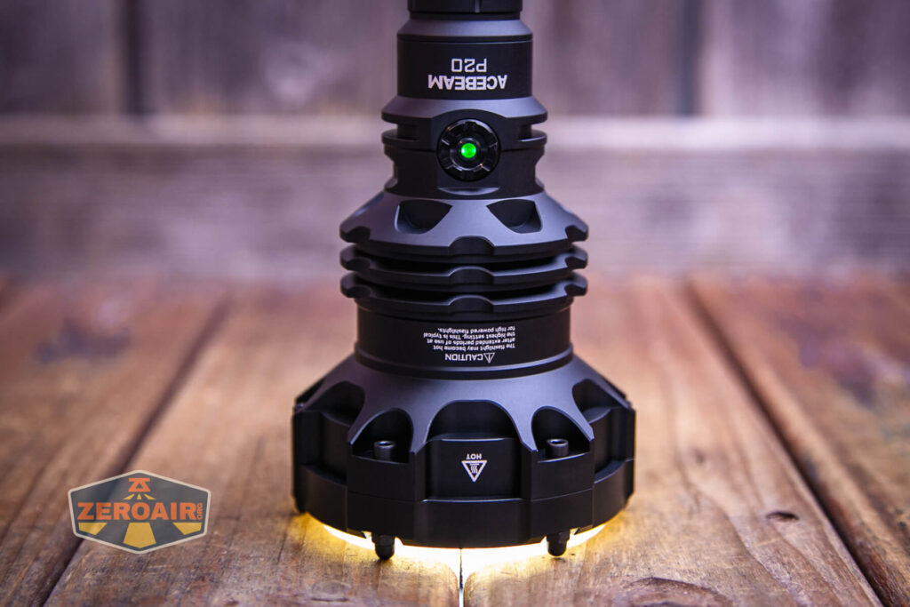 Acebeam P20 flashlight on and headstanding