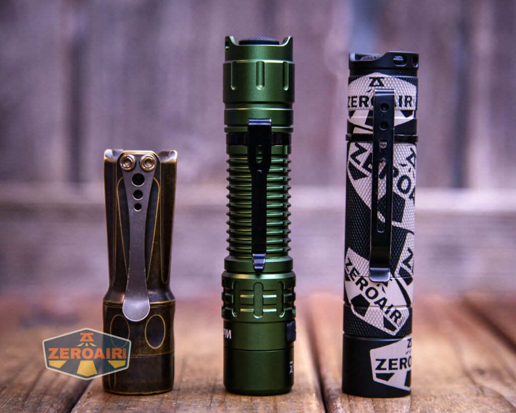 Wurkkos TD02 Green flashlight with two standard sized flashlights