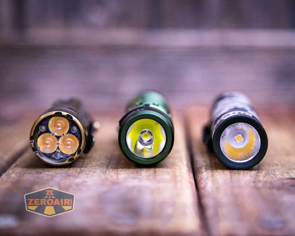 Wurkkos TD02 Green flashlight with two standard sized flashlights