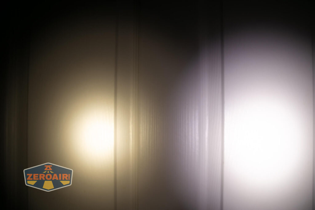 Tactile Turn Apollo flashlight beamshots on door compared to nichia 219b