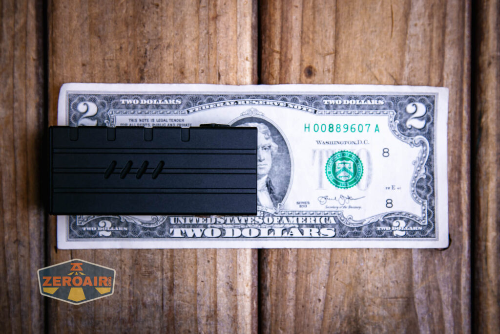 Vastlite Sima flashlight on a two dollar bill