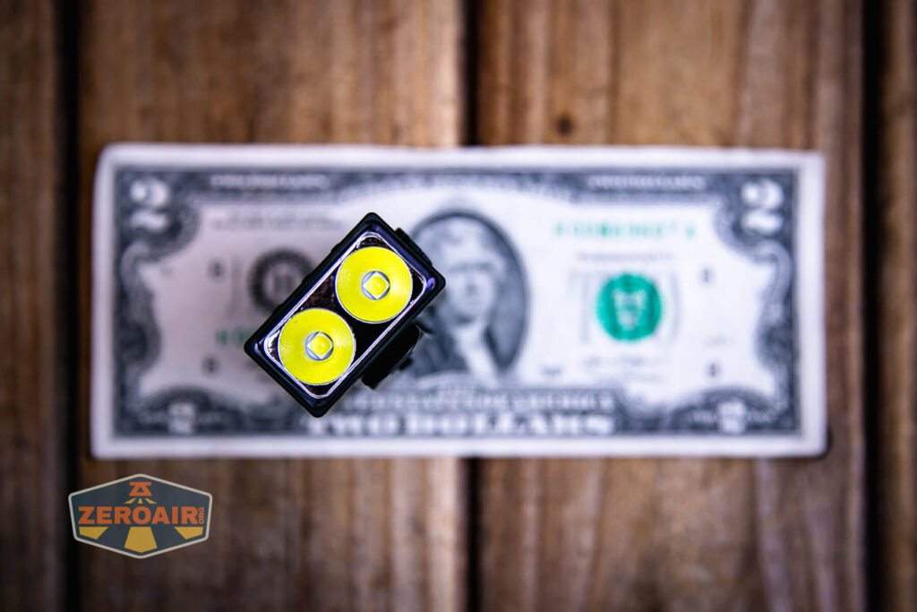 Vastlite Sima flashlight on a two dollar bill