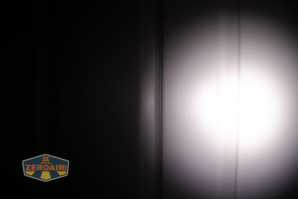 Vastlite Sima flashlight beamshots on door (at 1') compared to nichia 219b 4500K