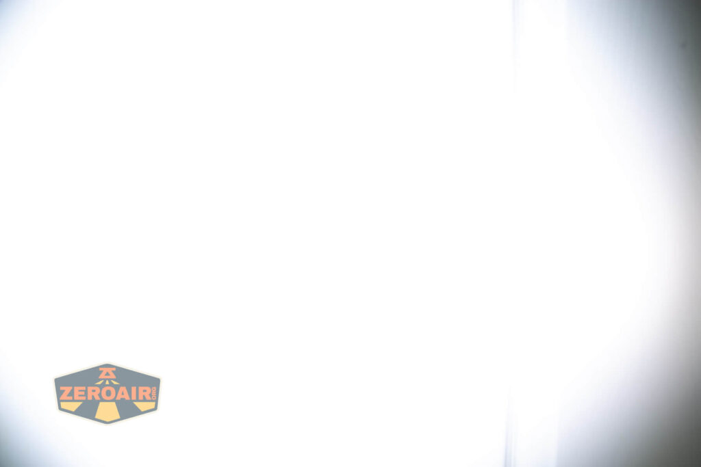 Vastlite Sima flashlight beamshots on door (at 1') compared to nichia 219b 4500K