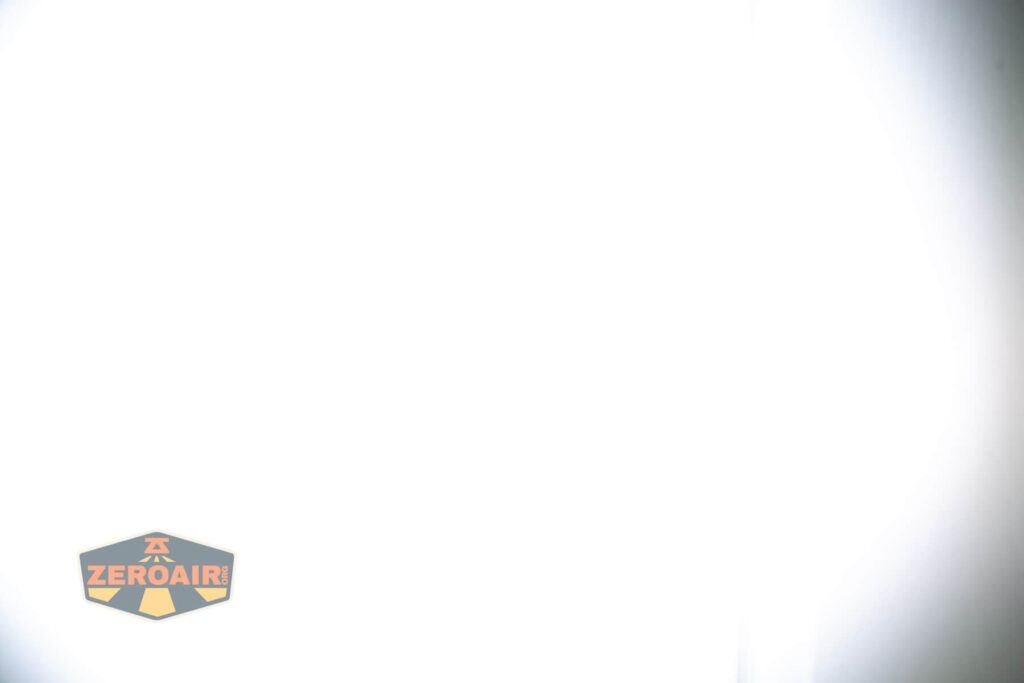 Vastlite Sima flashlight beamshots on door (at 1') compared to nichia 219b 4500K