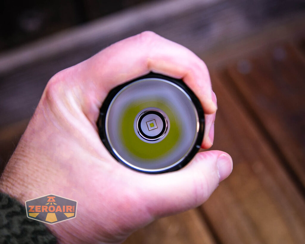 Skilhunt EC500 Coyote neutral white flashlight in hand