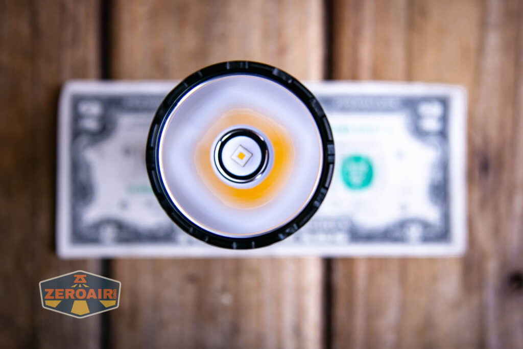 Skilhunt EC500 warm white flashlight on a two dollar bill