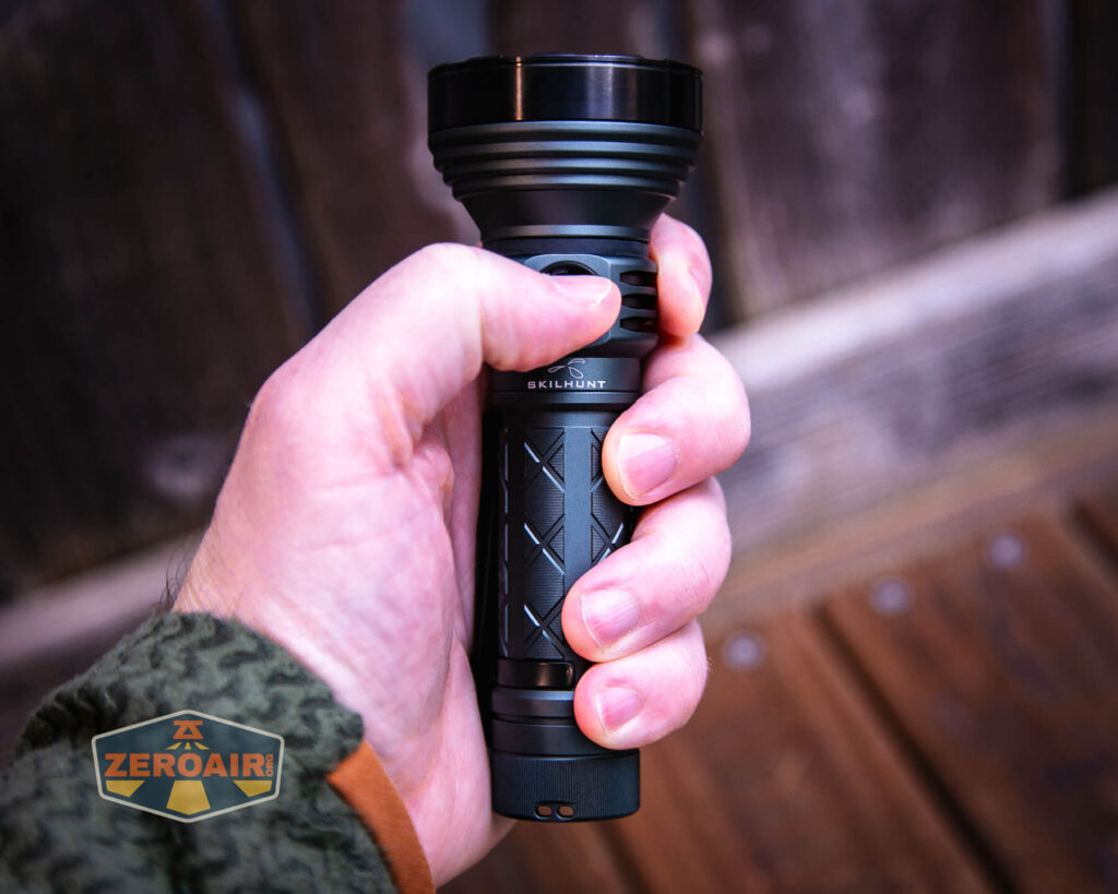 Skilhunt EC500 warm white flashlight in hand