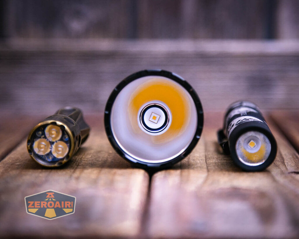 Skilhunt EC500 warm white flashlight with two standard sized flashlights