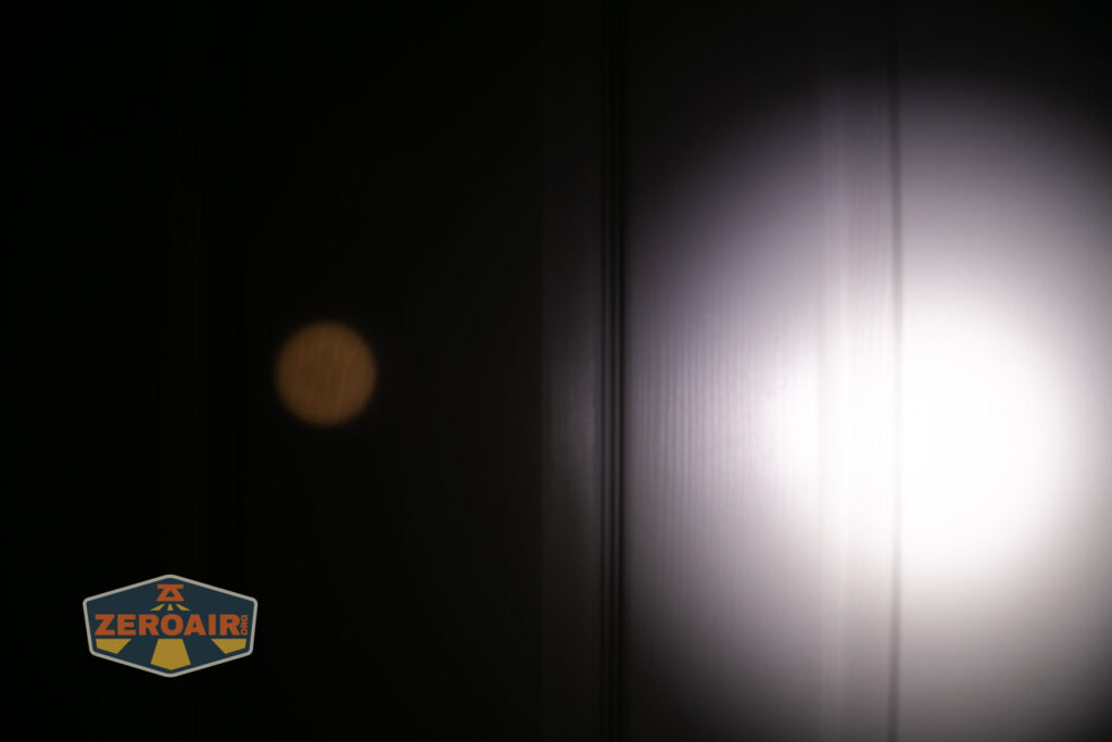 Skilhunt EC500 warm white flashlight beamshots on door (at 1') compared to nichia 219b 4500K