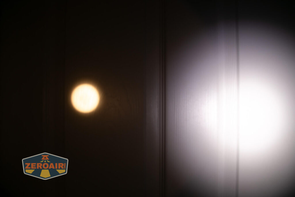 Skilhunt EC500 warm white flashlight beamshots on door (at 1') compared to nichia 219b 4500K